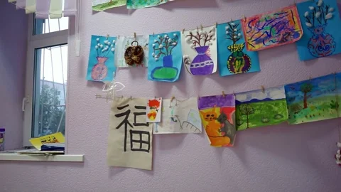 Children's paintings on the wall Stock Footage 77344920