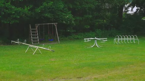 Children's park next to the forest Stock Footage 313544879