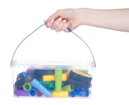 Children's plastic constructor with wheels in hand Stock Photos