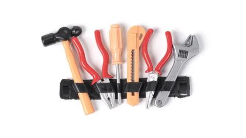 Children's plastic toy construction tools isolated on white background. Fotos Stock