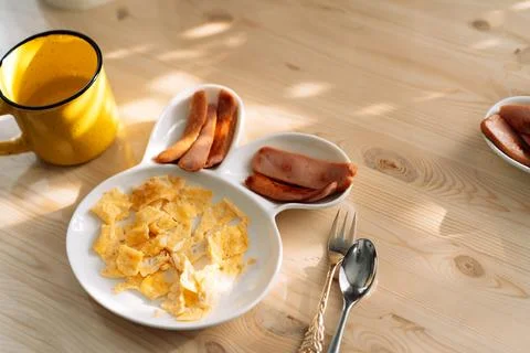 Children's plate in the form of hare for separate meals. Children's breakfast Stock Photos