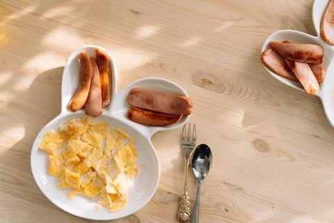Children's plate in the shape of hare for separate meals Stock Photos