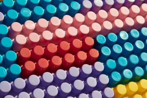 Children's play background: the plane of plastic multi-colored bricks, blur,  Stock Photos