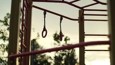 Childrens playground with climbing frames in the rain. Empty wet playground with Stock Footage 251738265
