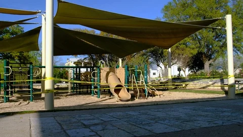 Children's playground closed down due to coronavirus outbreak. Video stock 127649204