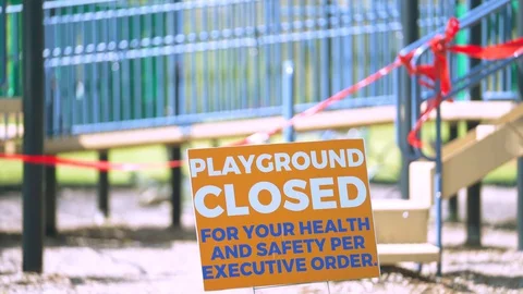 Children's playground closed off with red caution tape Vídeos de archivo 129469463