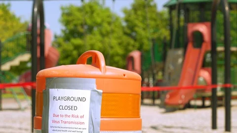 Children's playground closed off with red caution tape Video stock 129470799