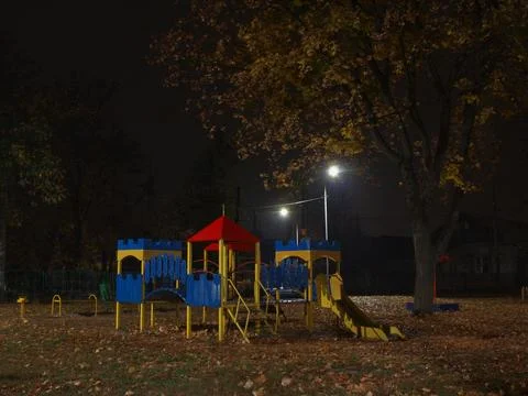 Children's playground at night Stock Photos