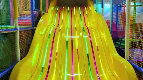 Children's playground with yellow plastic slider. Game room. 動画素材 280593623