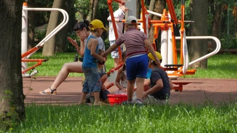 Childrens playing on playground in park Stock Footage 93712411