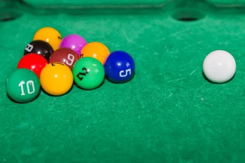Children's pool table game with multicolored balls Stock Photos