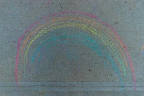 Children's rainbow pattern on a cement pavement Stock Photos