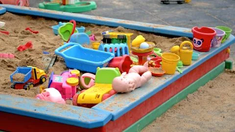 Children's Sandbox. Set Of Colored Plastic Toys On The Sand,  Stock Photos