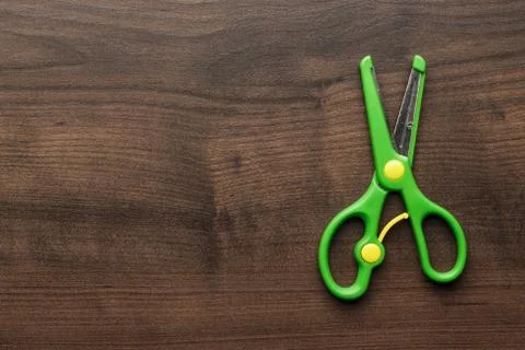 Children's scissors on the table Stock Photos
