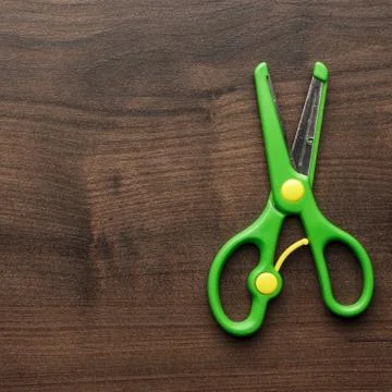 Children's scissors on the table Stock Photos