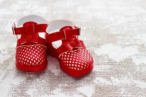 Children's shoes on a light background Stock Photos