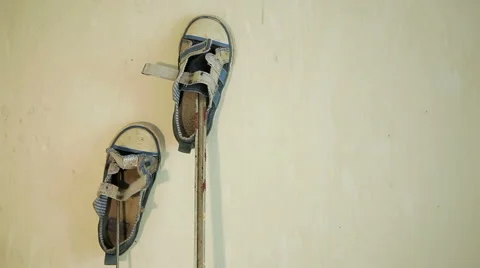Children's shoes on the wall Stock Footage 50394748