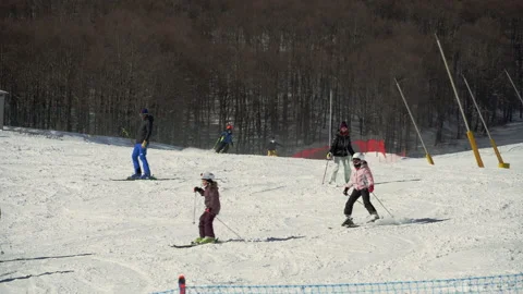 Children's ski school have fun on the ski slopes of the Aremogna ski area Stock Footage 170398387