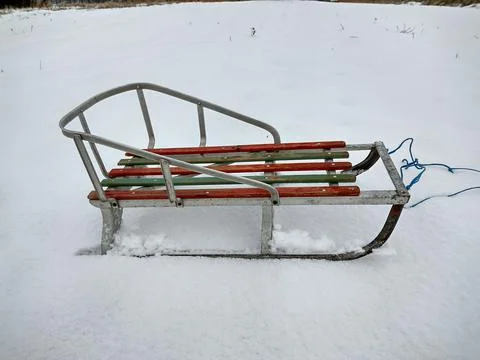 Children's sledge on the snow 库存照片