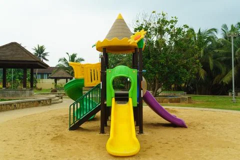 Children's slide on the sand Stock Photos