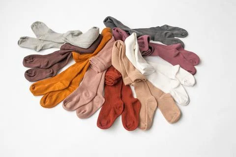 Children's socks, children's wardrobe White background, top view. Stock Photos