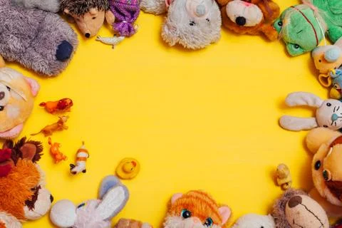 Children's soft toys for developing games on a yellow background Stock Photos