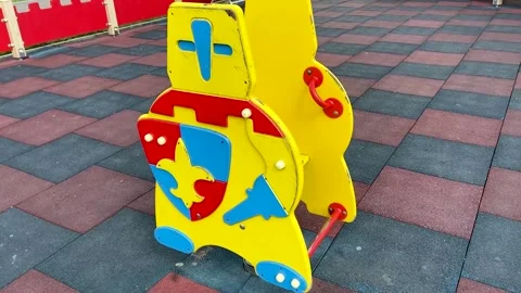 Children's spring swing in the form of a knight on the playground Stock Footage 160032154
