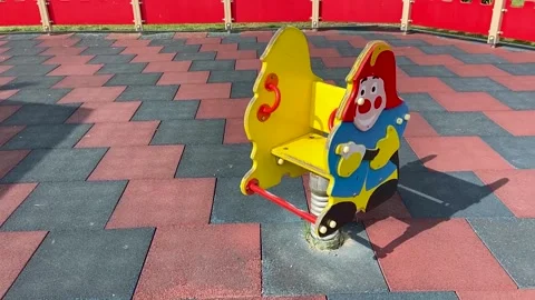 Children's spring swing in the shape of a fireman in the playground Stock Footage 158832191