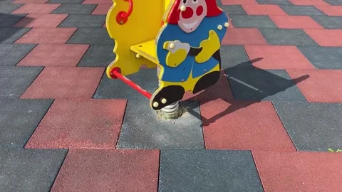 Children's spring swing in the shape of a fireman Stock Footage 159087032