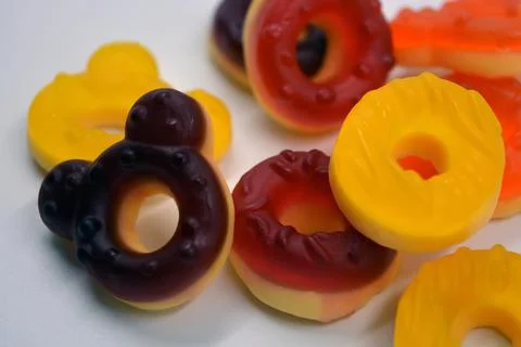 Children's sweets in the form of multi-colored donuts, chewable, gelatin sweets. Stock Photos