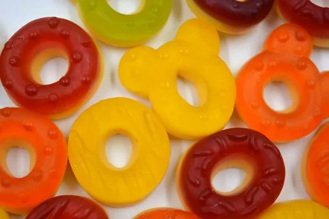 Children's sweets in the form of multi-colored donuts, chewable, gelatin sweets. Stock Photos