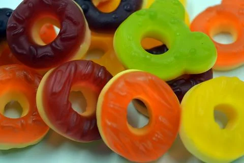 Children's sweets in the form of multi-colored donuts, chewable, gelatin sweets. Stock Photos