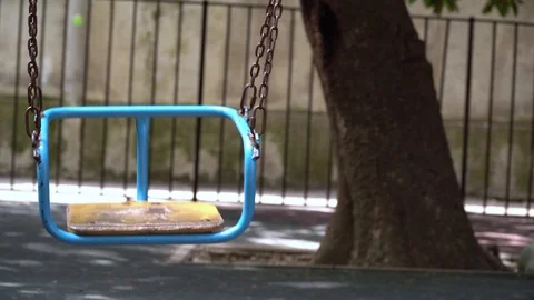 Children’s swing on chains against Stock Footage 115730511