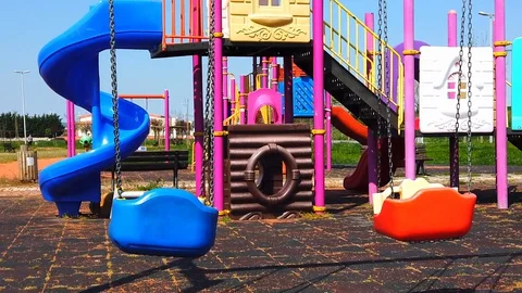 Children's swing, empty playground. Stock Footage 129898399