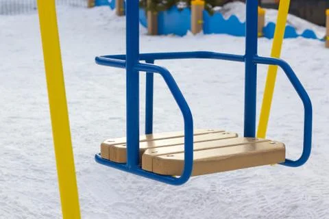 Children's swing is empty on the playground Stock-Fotos