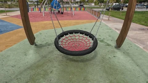 A Children's Swing at a Playground Stock Footage 250456990