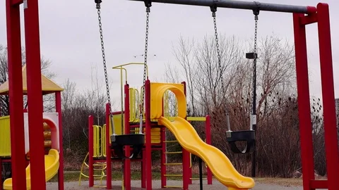 Children's swing set at a playground. Stock Footage 83658409