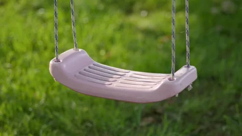 Children's swing in the sunlight Stock Footage 318727045