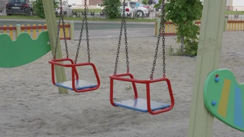 Children's swing swaying in the wind Stock Footage 132494649