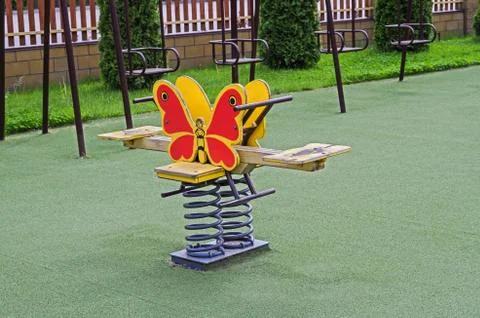 Childrens swing on twisted spring Stock Photos