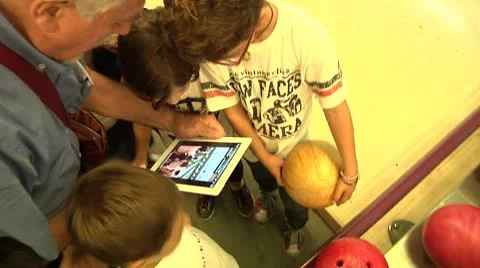 Childrens touching and playing with Digital Tablet (iPad). Stock Footage 8840311