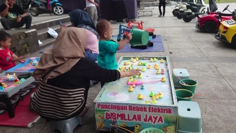 Children's toy in the form of a small duck that can spin itself Stock Footage 290100545