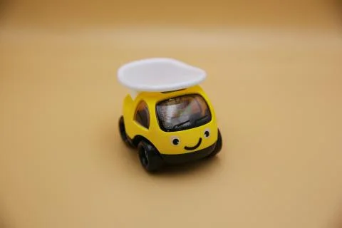 Children's toys, cars in a yellow background Stock Photos