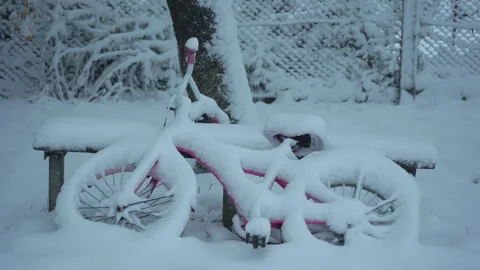 A child's bicycle under a thick layer of snow Stock-Footage 330259256