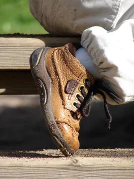 Child's brown boot Stock Photos