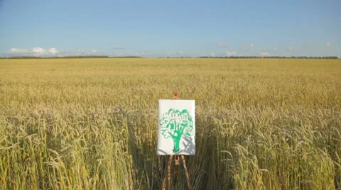 Child's drawing of green tree by chalk in wheat field 库存影片 7910230
