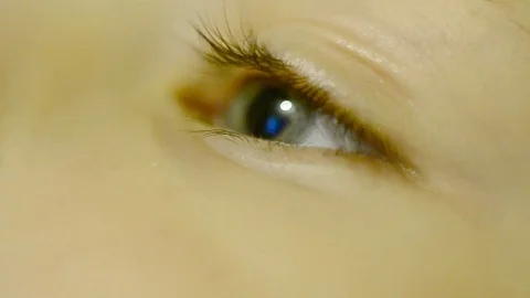 Child's eye is looking at the phone Stock Footage 82480646