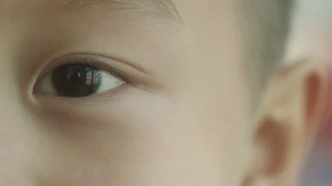 Child's Eye Opening from Closed State, Extreme Close-up Portrait 库存影片 334639037