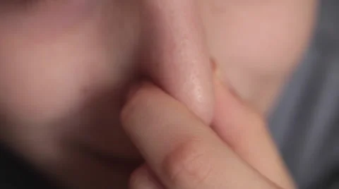 Child's facial expression while holding his nose to protect from bad smell Vídeos de archivo 60808270
