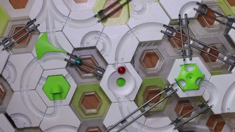 The child's finger sets in motion three balls. Stock Footage 252418399